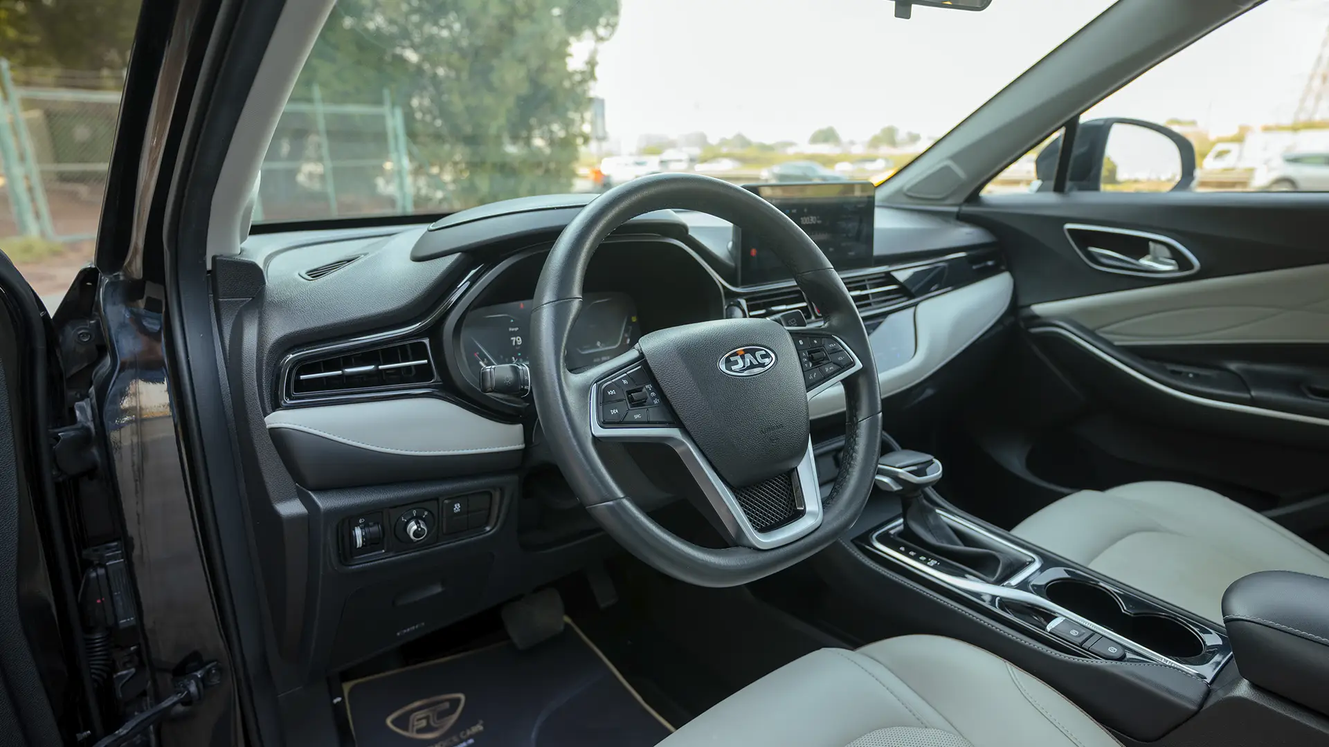 Used 2023 JAC JS4 Intelligent in Black – Driver Side Dashboard & Steering View for Sale at First Choice Cars Dubai Sharjah