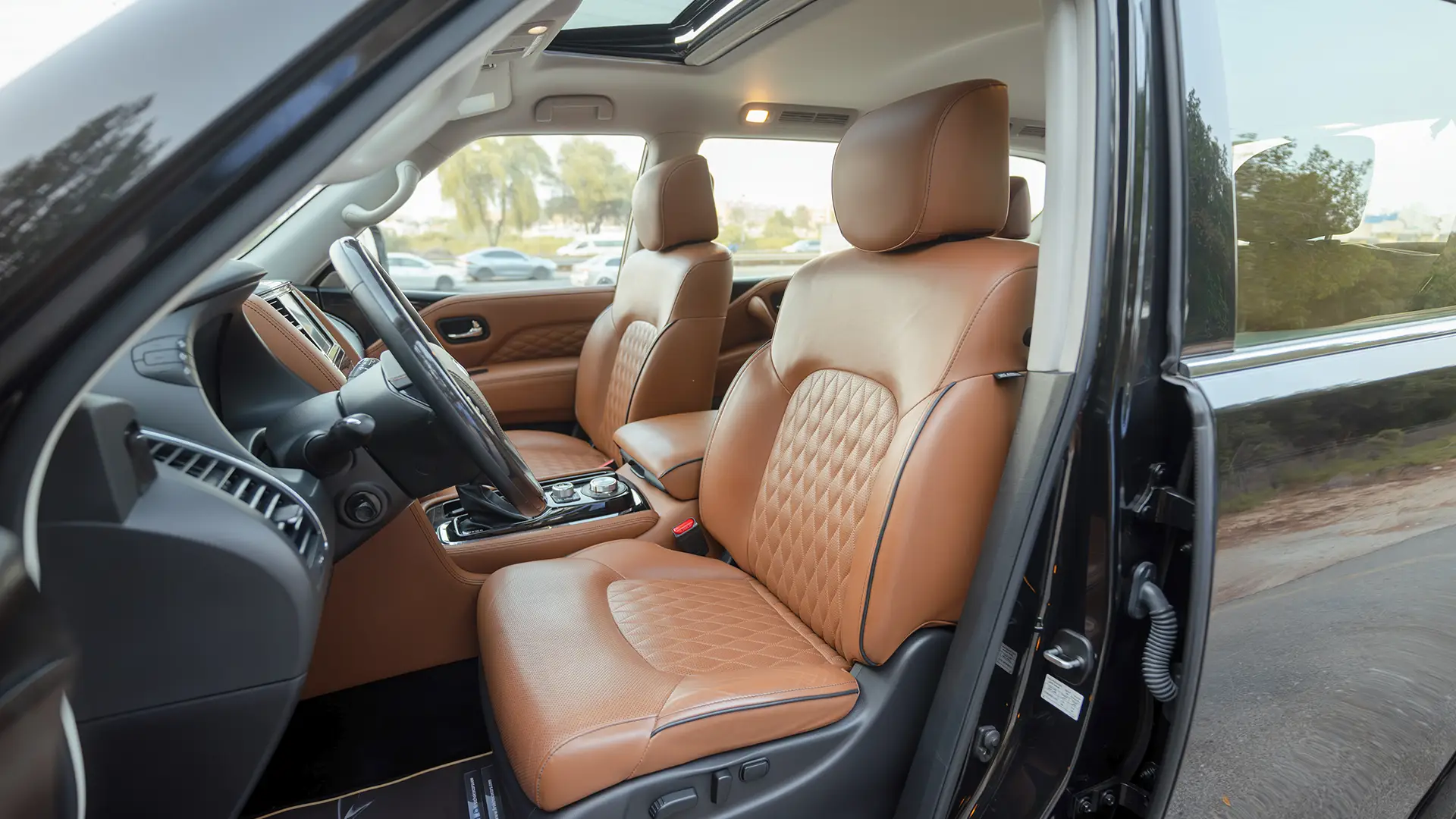 Used 2021 Infiniti QX80 Sensory in Black – Front Driver Side Cabin View for Sale at First Choice Cars Dubai Sharjah