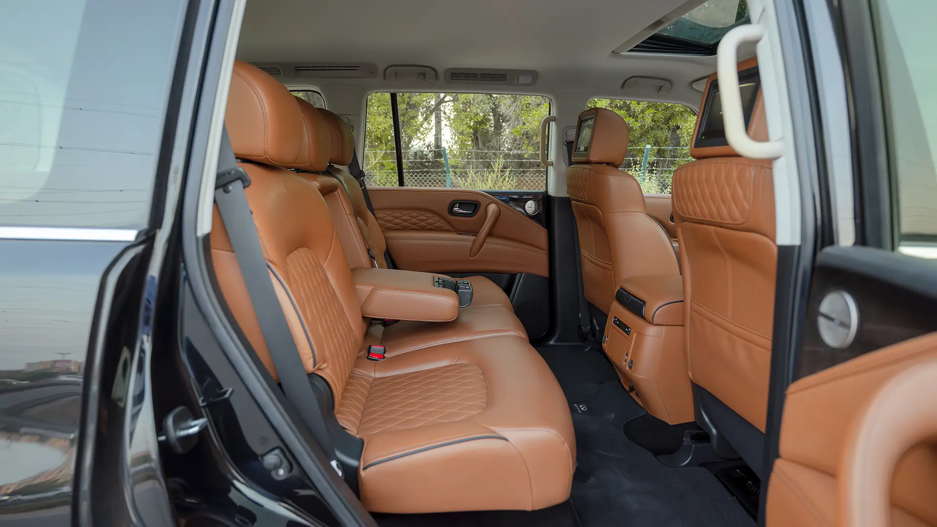 Used 2021 Infiniti QX80 Sensory in Black – Rear Passenger Side Cabin View for Sale at First Choice Cars Dubai Sharjah