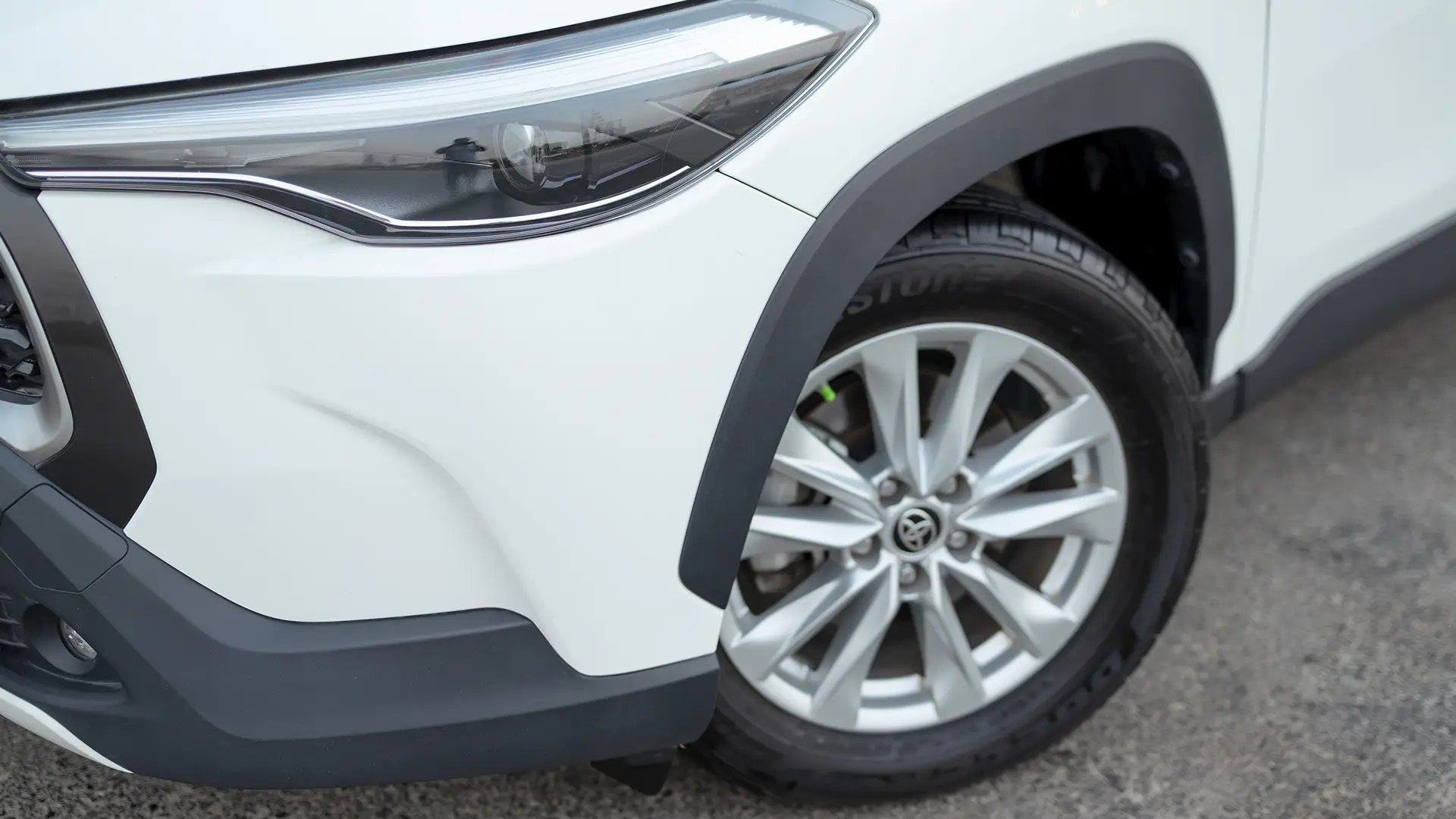 Used 2022 Toyota Corolla Cross GLi in White – Headlight Close-up for Sale at First Choice Cars Dubai Sharjah