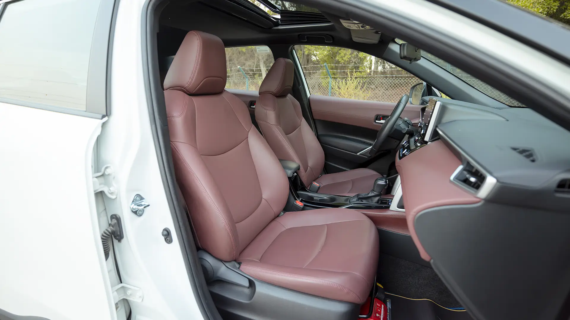 Used 2022 Toyota Corolla Cross GLi in White – Front Passenger Side Cabin View for Sale at First Choice Cars Dubai Sharjah