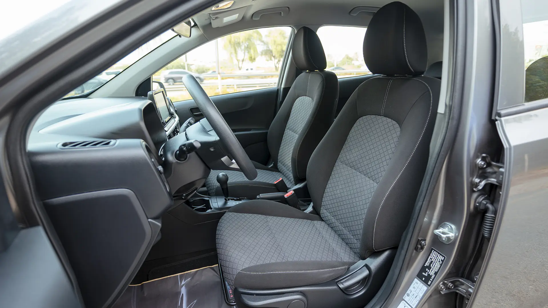 Used 2024 Kia Picanto LX in Grey – Front Driver Side Cabin View for Sale at First Choice Cars Dubai Sharjah