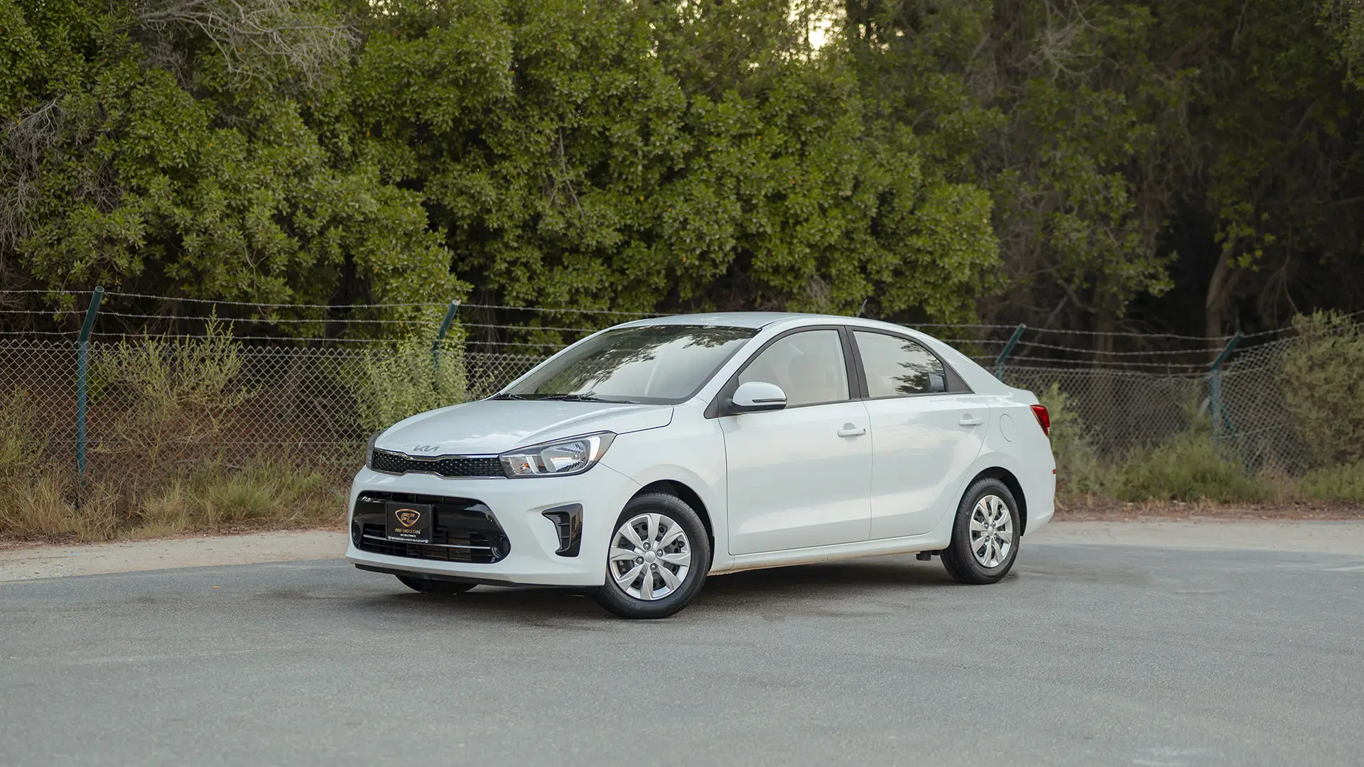 Used 2024 Kia Pegas EX in White – Left Front Diagonal (45°) View for Sale at First Choice Cars Dubai Sharjah