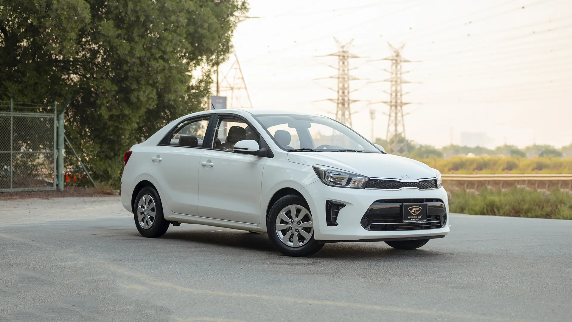 Used 2024 Kia Pegas EX in White – Right Front Diagonal (45°) View for Sale at First Choice Cars Dubai Sharjah