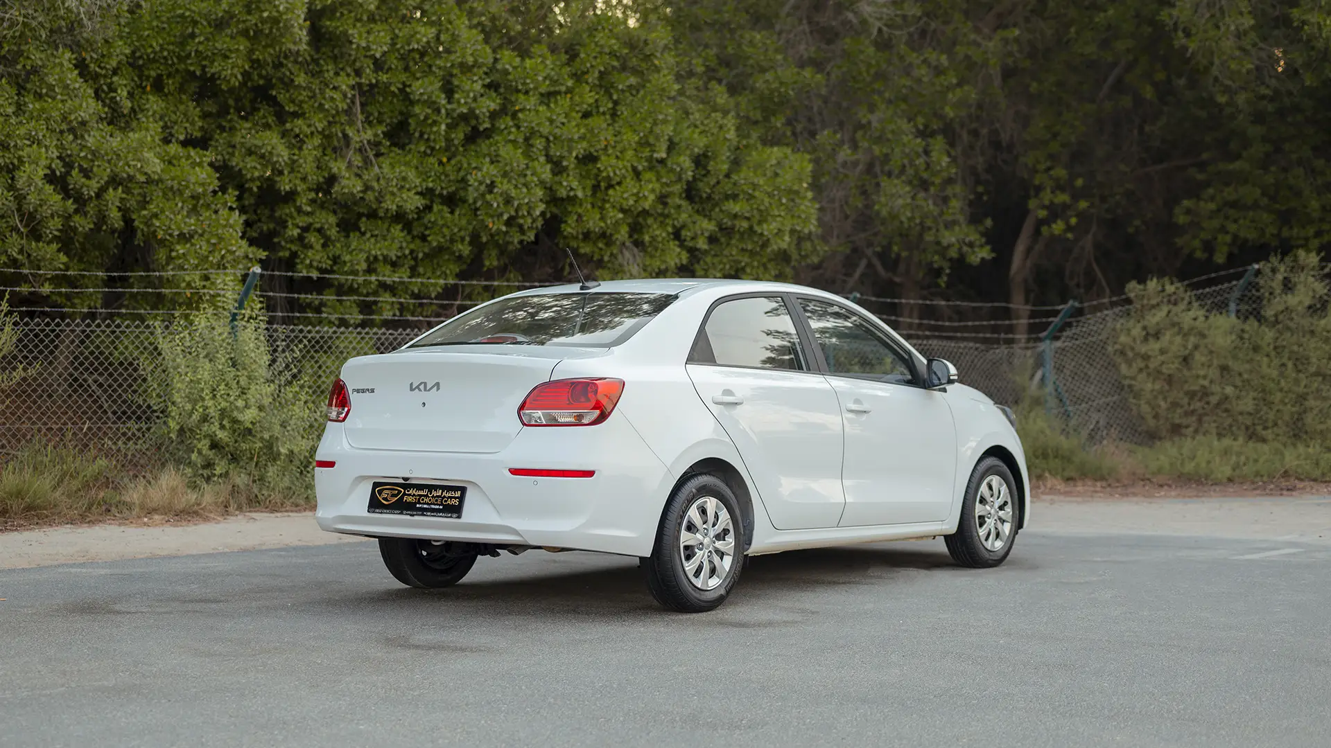 Used 2024 Kia Pegas EX in White – Right Back Diagonal (45°) View for Sale at First Choice Cars Dubai Sharjah