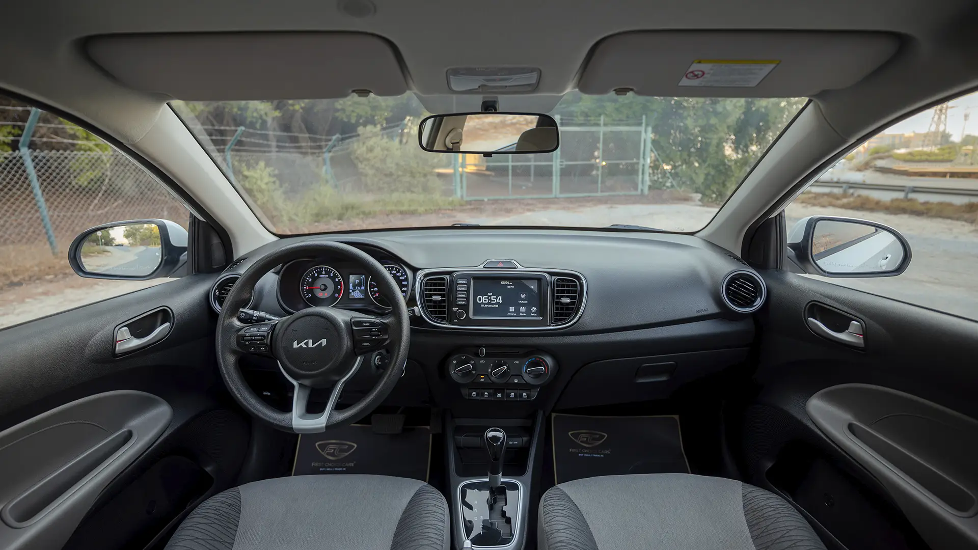 Used 2024 Kia Pegas EX in White – Front Cabin / Dashboard Full View for Sale at First Choice Cars Dubai Sharjah