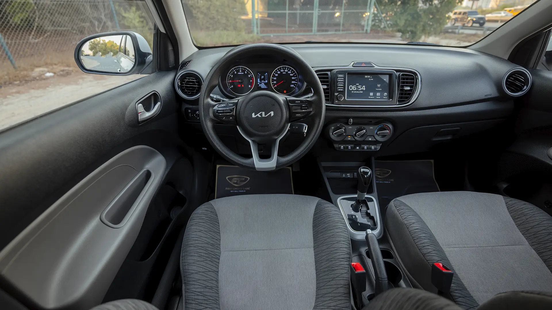 Used 2024 Kia Pegas EX in White – Steering Wheel & Instrument Cluster for Sale at First Choice Cars Dubai Sharjah