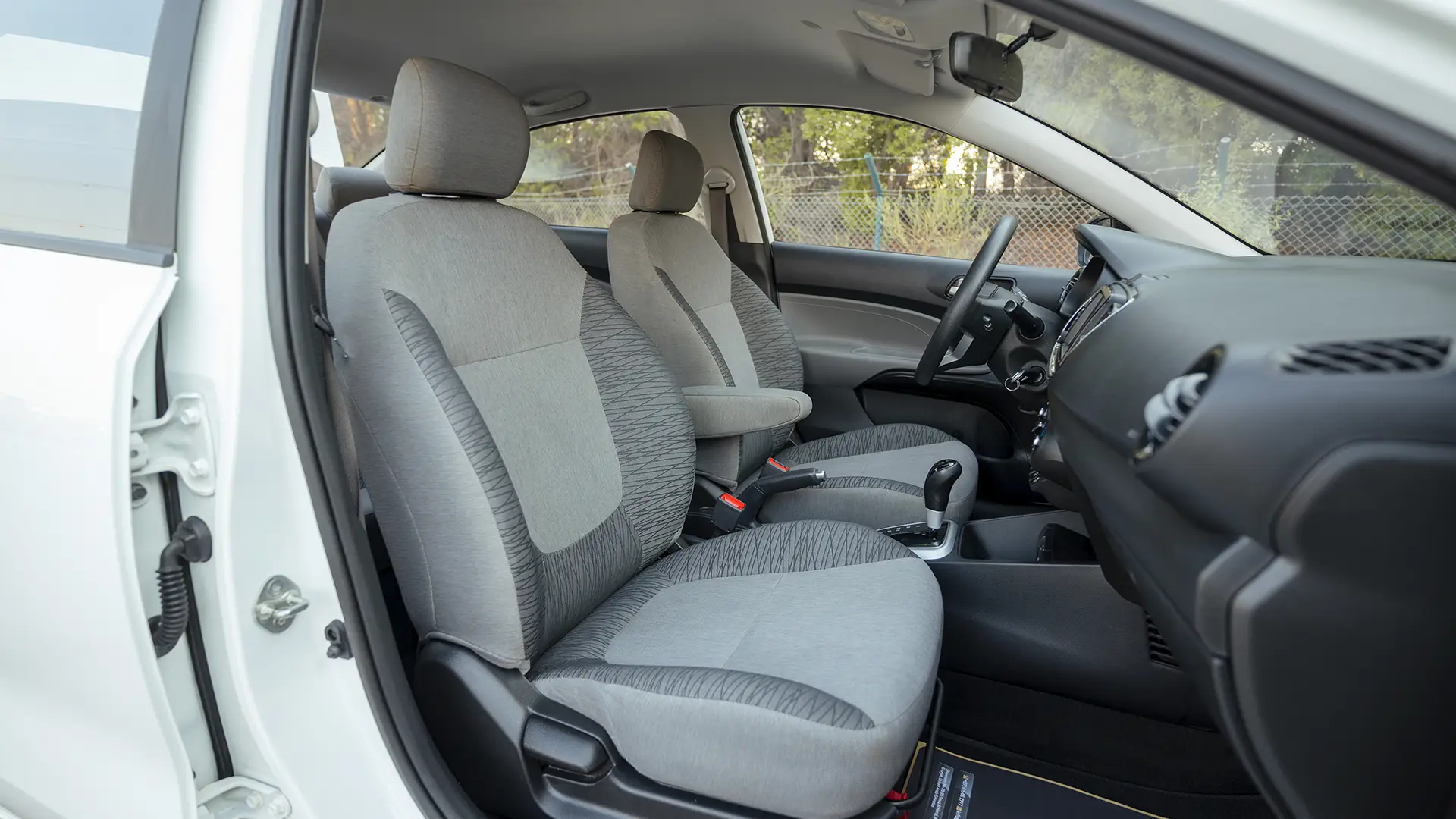 Used 2024 Kia Pegas EX in White – Front Passenger Side Cabin View for Sale at First Choice Cars Dubai Sharjah