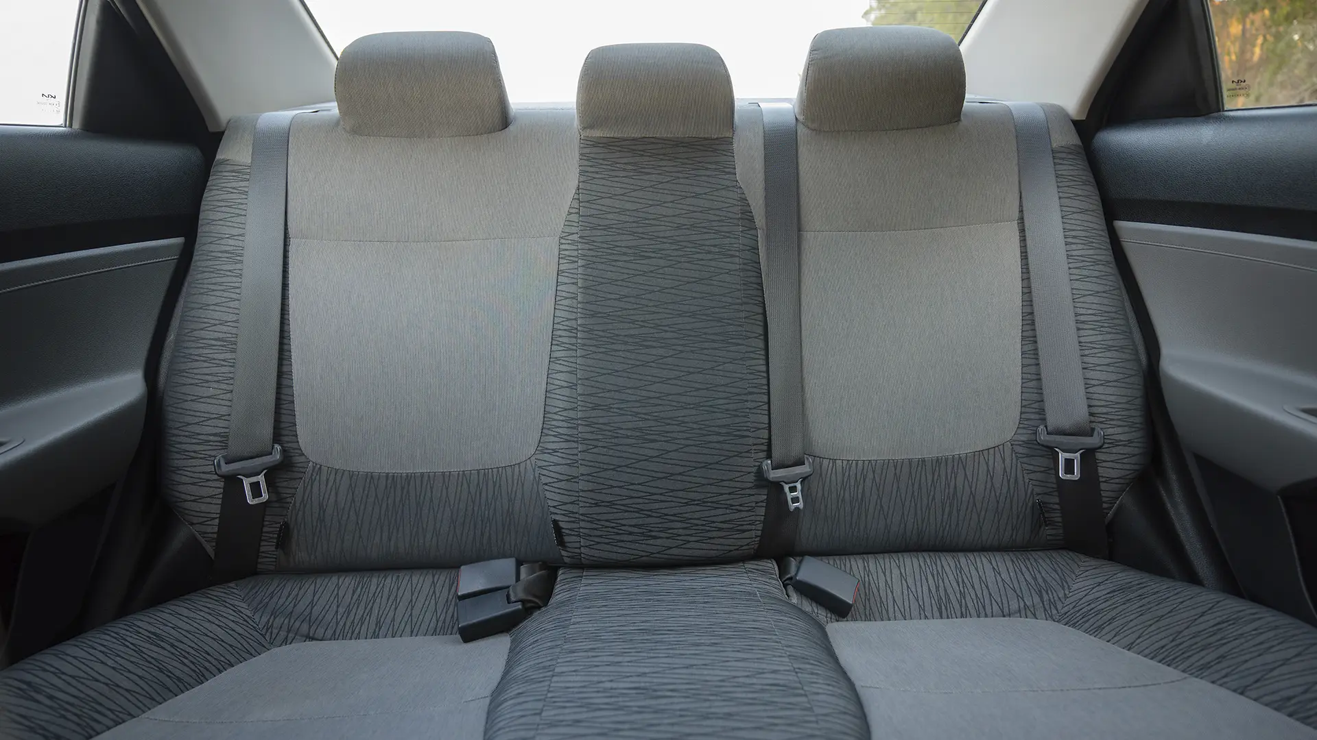Used 2024 Kia Pegas EX in White – Rear Seat View for Sale at First Choice Cars Dubai Sharjah