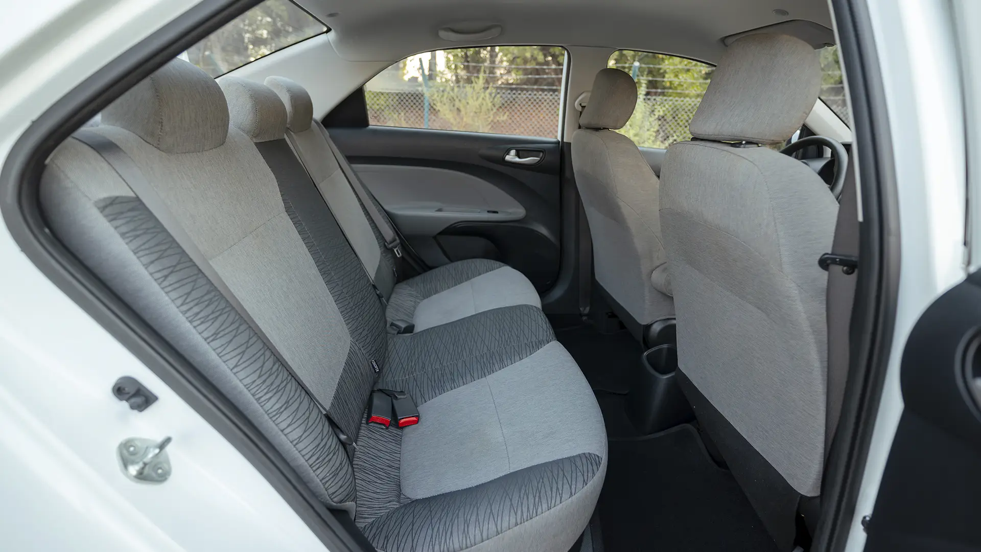 Used 2024 Kia Pegas EX in White – Rear Passenger Side Cabin View for Sale at First Choice Cars Dubai Sharjah