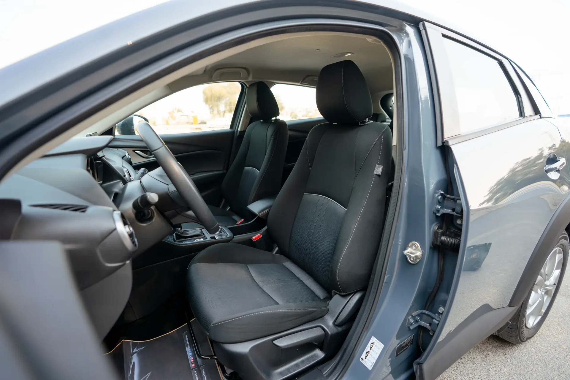 Used 2023 Mazda CX-3 GS in Blue – Front Driver Side Cabin View for Sale at First Choice Cars Dubai Sharjah