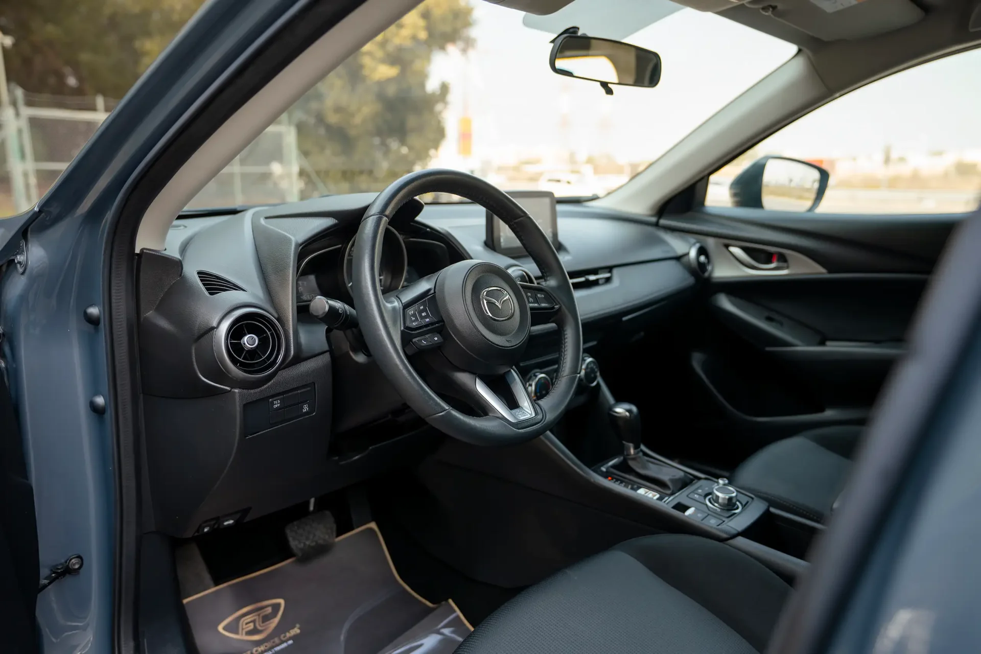 Used 2023 Mazda CX-3 GS in Blue – Driver Side Dashboard & Steering View for Sale at First Choice Cars Dubai Sharjah