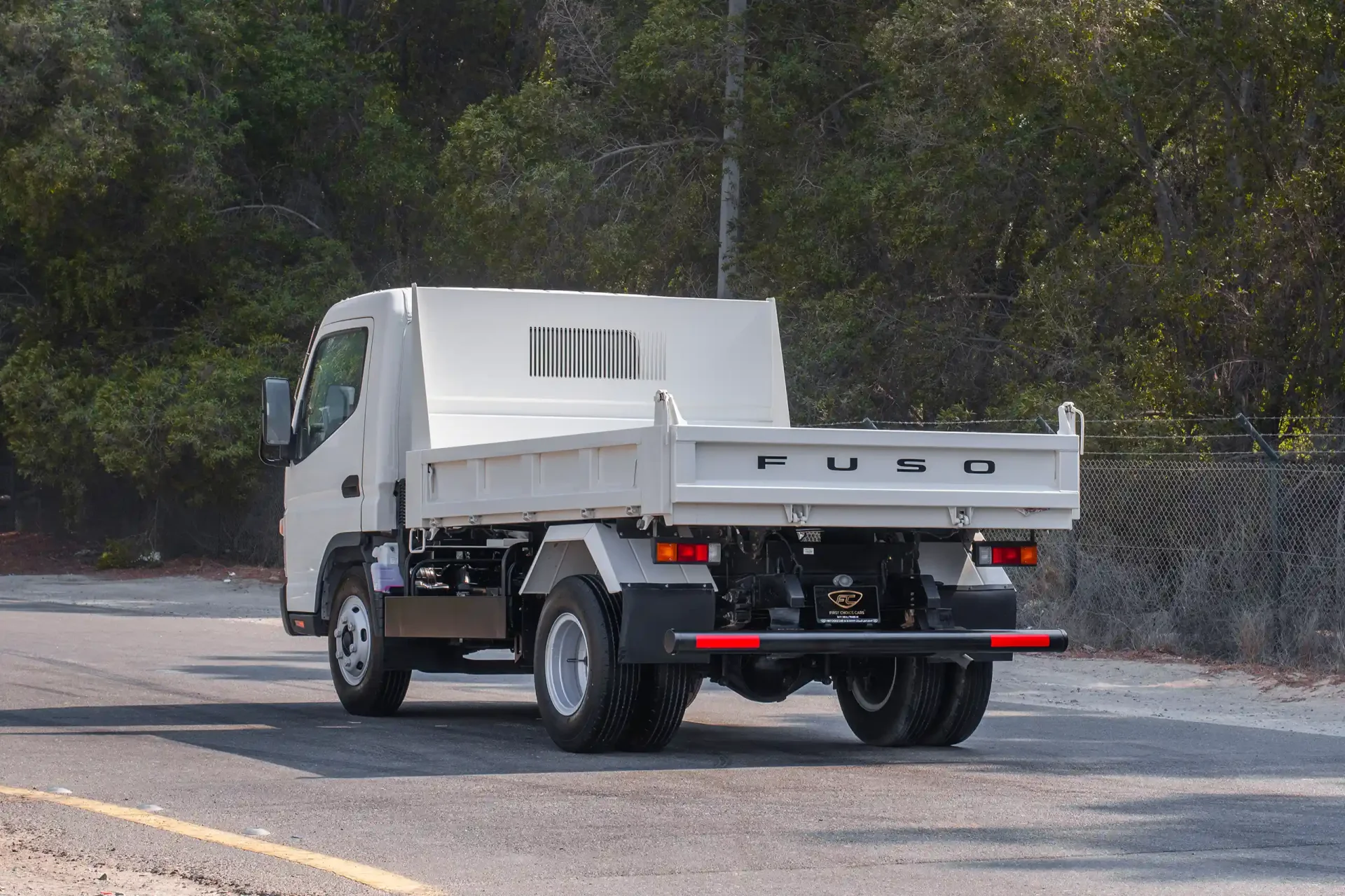 Used 2024 Mitsubishi Canter Tipper in White – Left Back Diagonal (45°) View for Sale at First Choice Cars Dubai Sharjah
