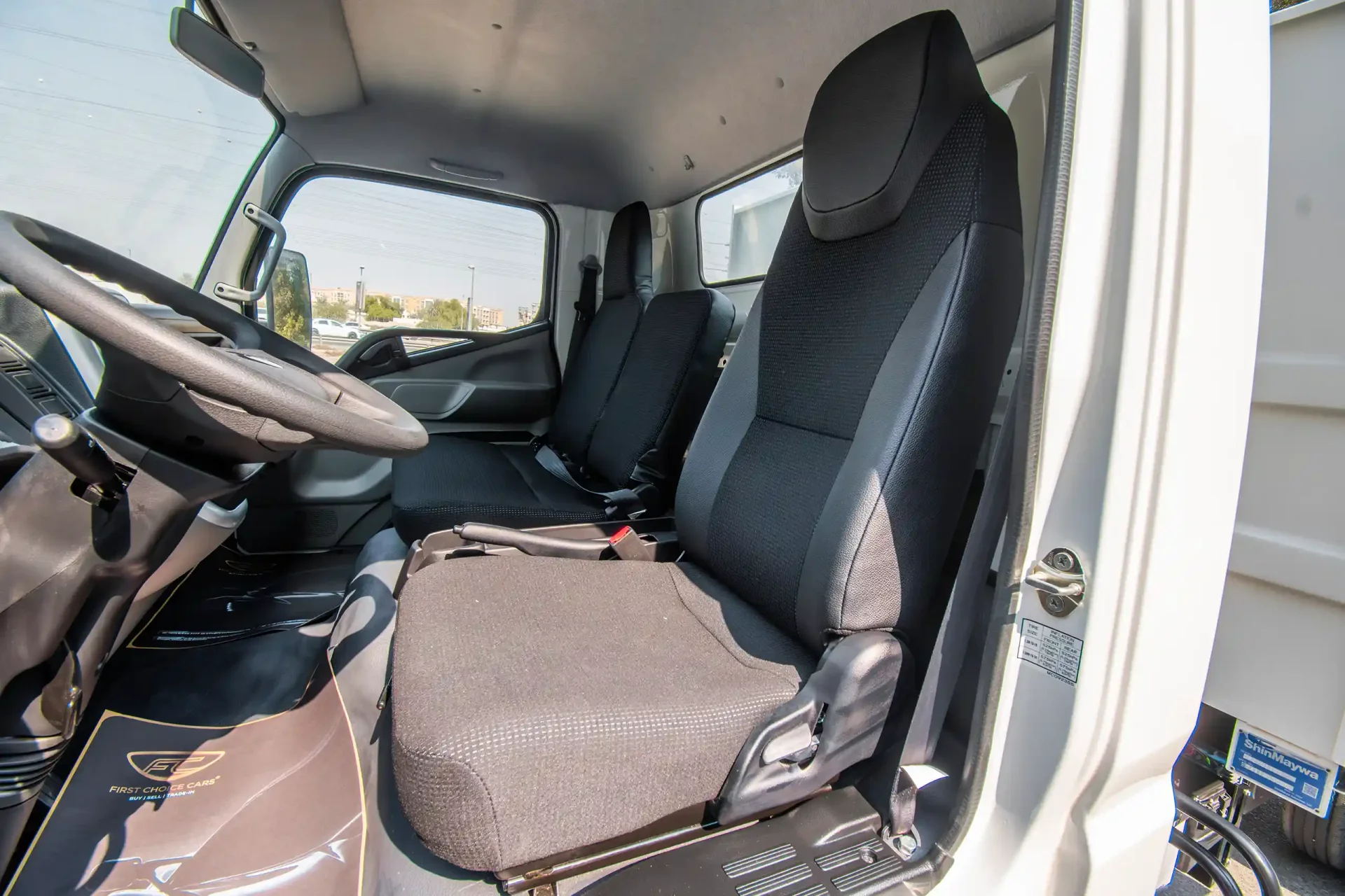 Used 2024 Mitsubishi Canter Tipper in White – Front Driver Side Cabin View for Sale at First Choice Cars Dubai Sharjah