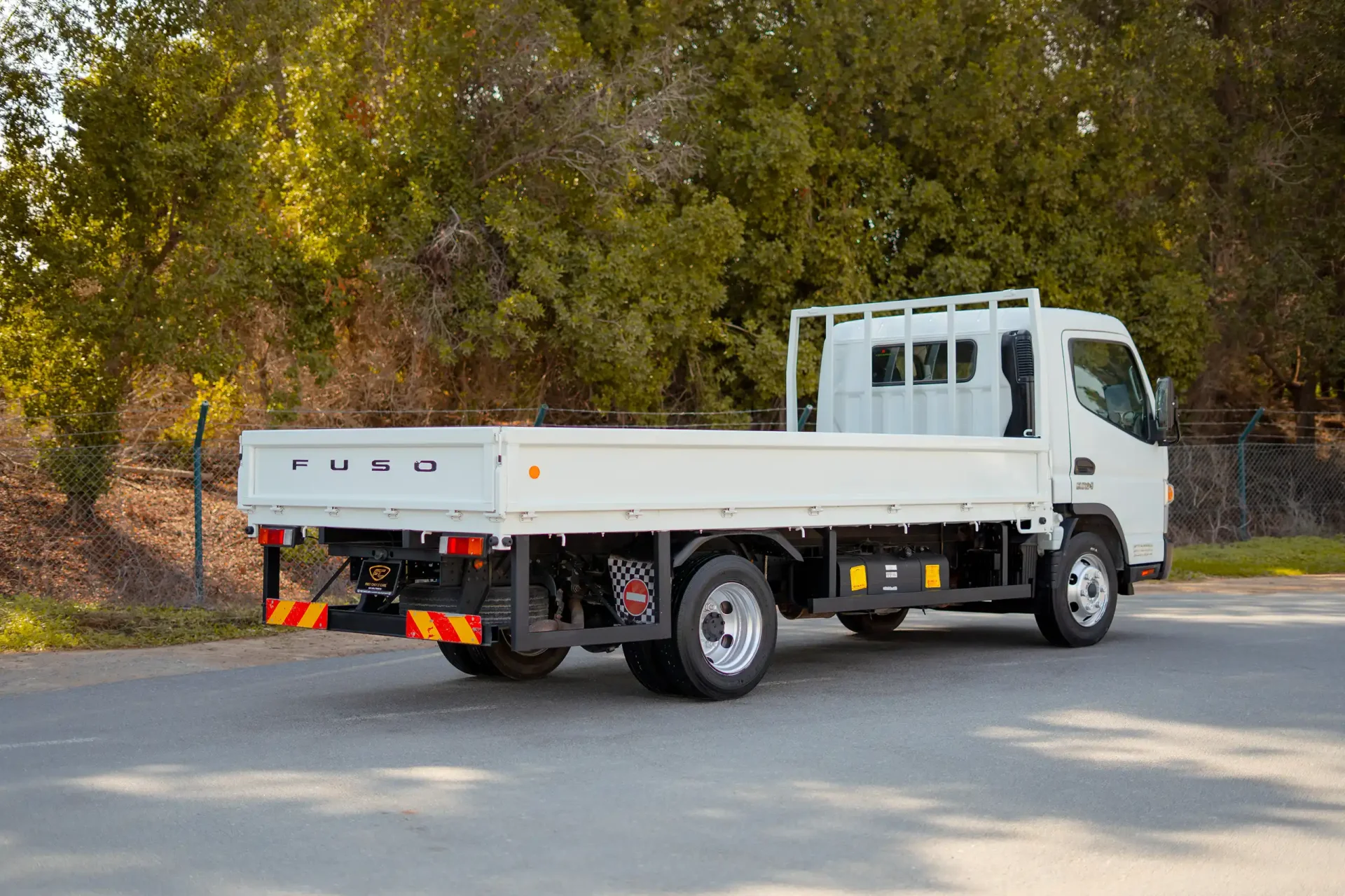 Used 2023 Mitsubishi Canter Cargo Body in White – Right Back Diagonal (45°) View for Sale at First Choice Cars Dubai Sharjah