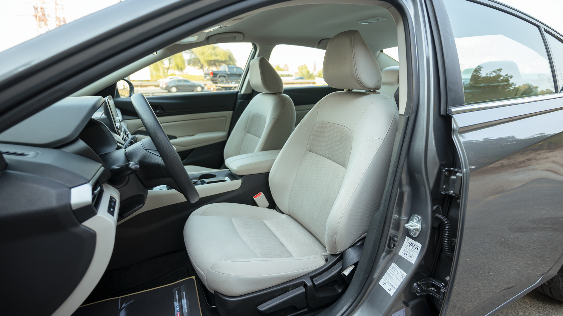 Used 2024 Nissan Altima S in Grey – Front Driver Side Cabin View for Sale at First Choice Cars Dubai Sharjah