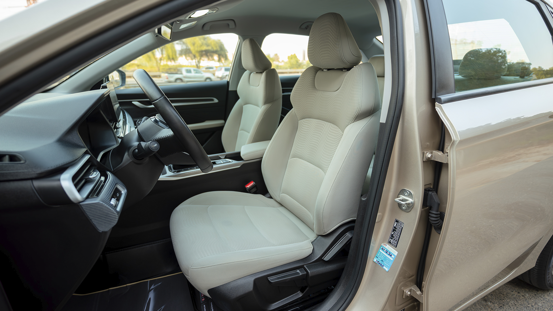 Used 2024 Geely Emgrand GS in Gold – Front Driver Side Cabin View for Sale at First Choice Cars Dubai Sharjah