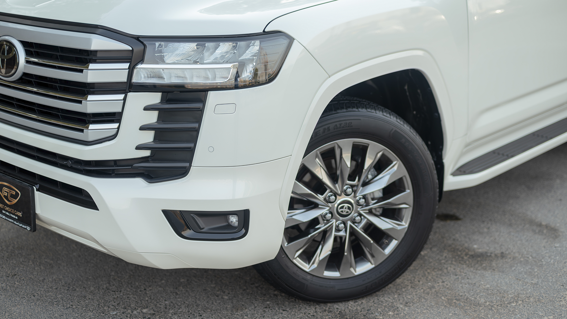 Used 2025 Toyota Land Cruiser GXR in White – Headlight Close-up for Sale at First Choice Cars Dubai Sharjah
