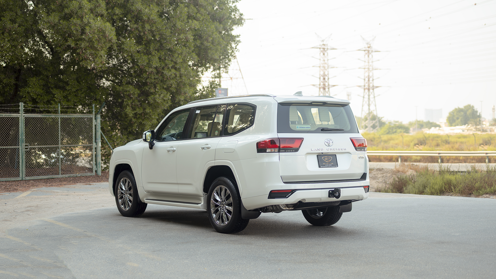 Used 2025 Toyota Land Cruiser GXR in White – Left Back Diagonal (45°) View for Sale at First Choice Cars Dubai Sharjah