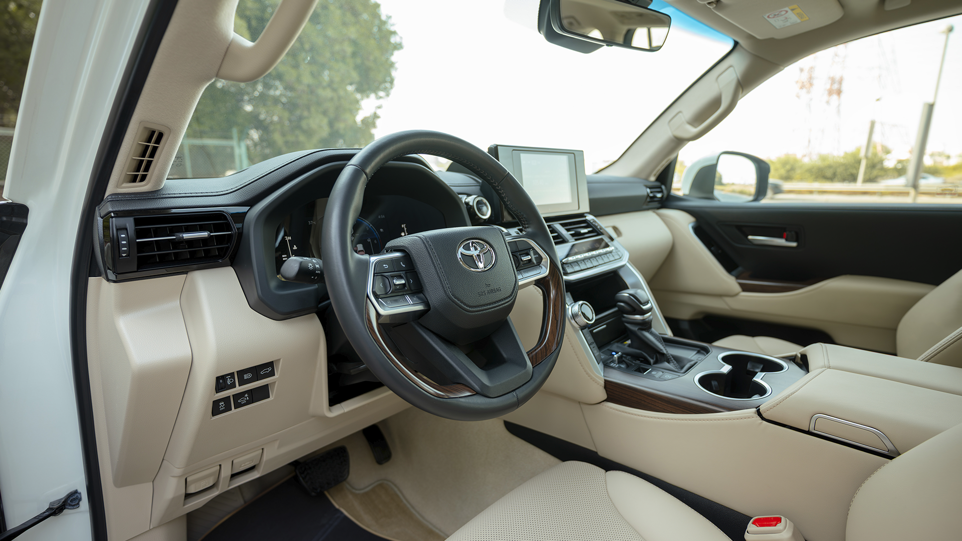 Used 2025 Toyota Land Cruiser GXR in White – Driver Side Dashboard & Steering View for Sale at First Choice Cars Dubai Sharjah
