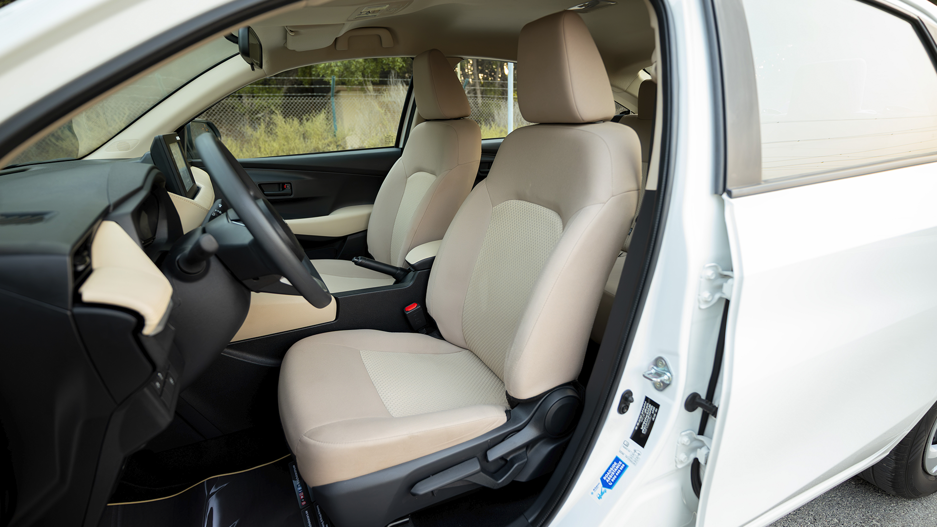 Used 2024 Toyota Yaris E in White – Front Driver Side Cabin View for Sale at First Choice Cars Dubai Sharjah