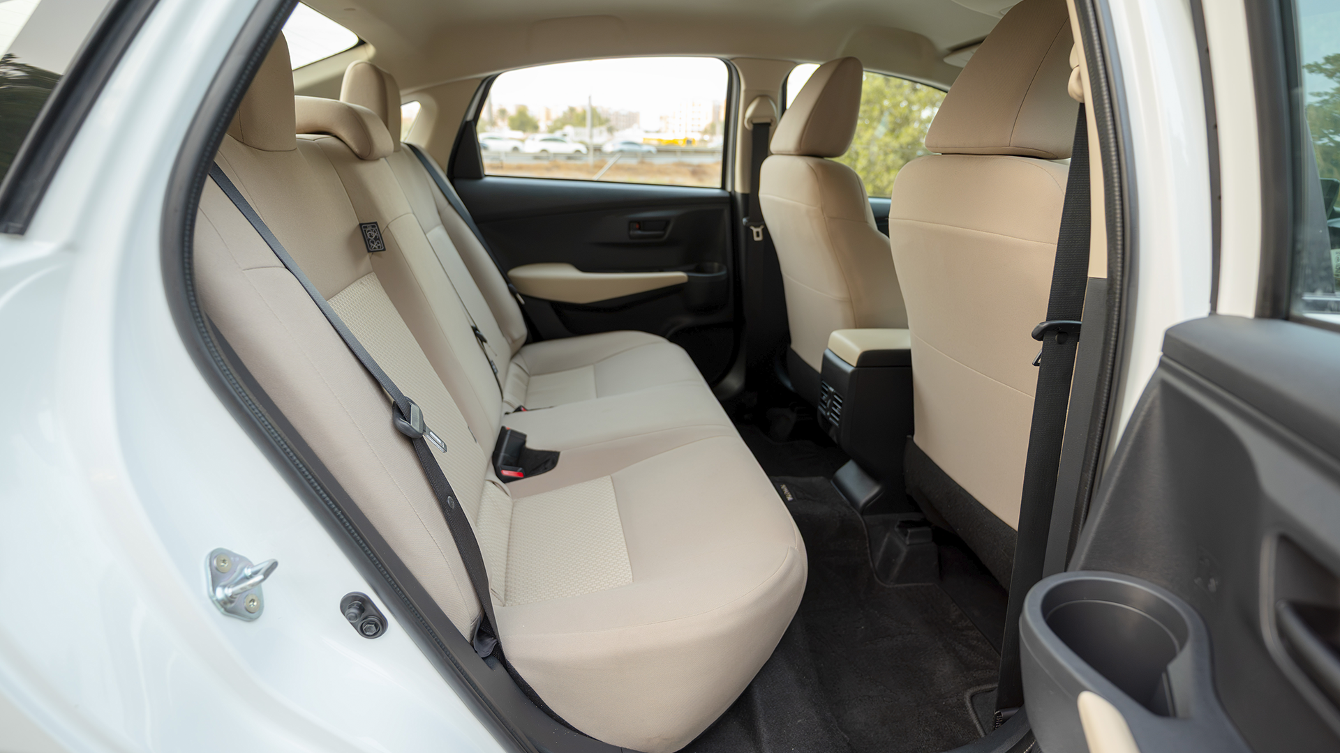 Used 2024 Toyota Yaris E in White – Rear Passenger Side Cabin View for Sale at First Choice Cars Dubai Sharjah