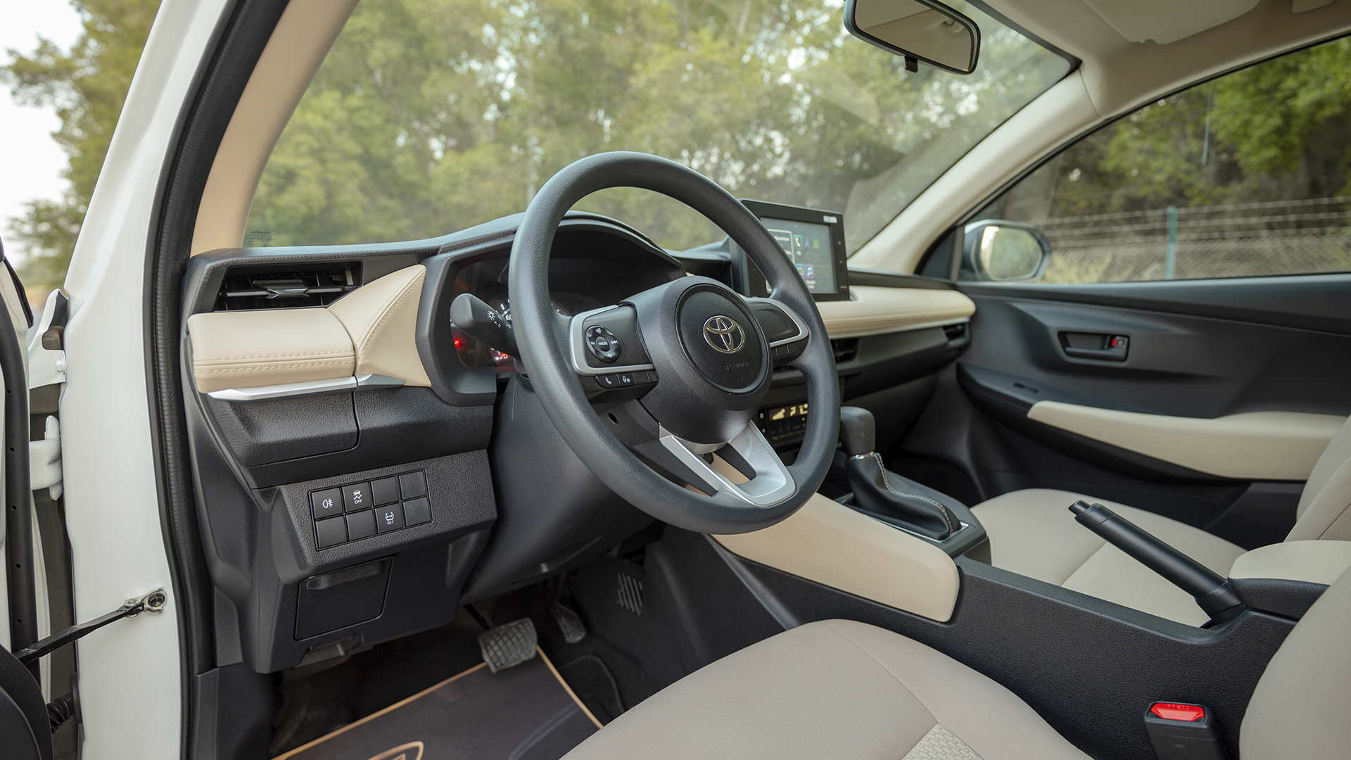 Used 2024 Toyota Yaris E in White – Driver Side Dashboard & Steering View for Sale at First Choice Cars Dubai Sharjah