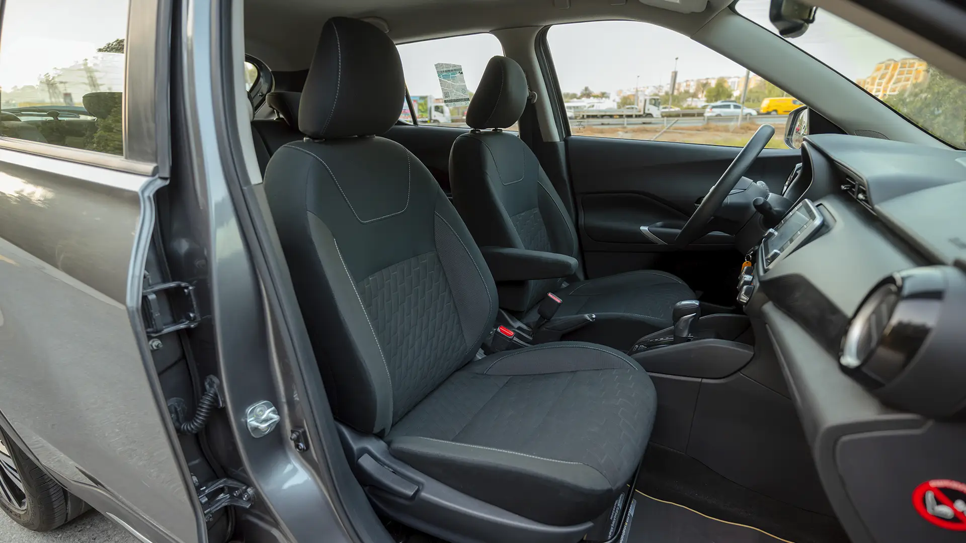 Used 2024 Nissan Kicks SV in Grey – Front Passenger Side Cabin View