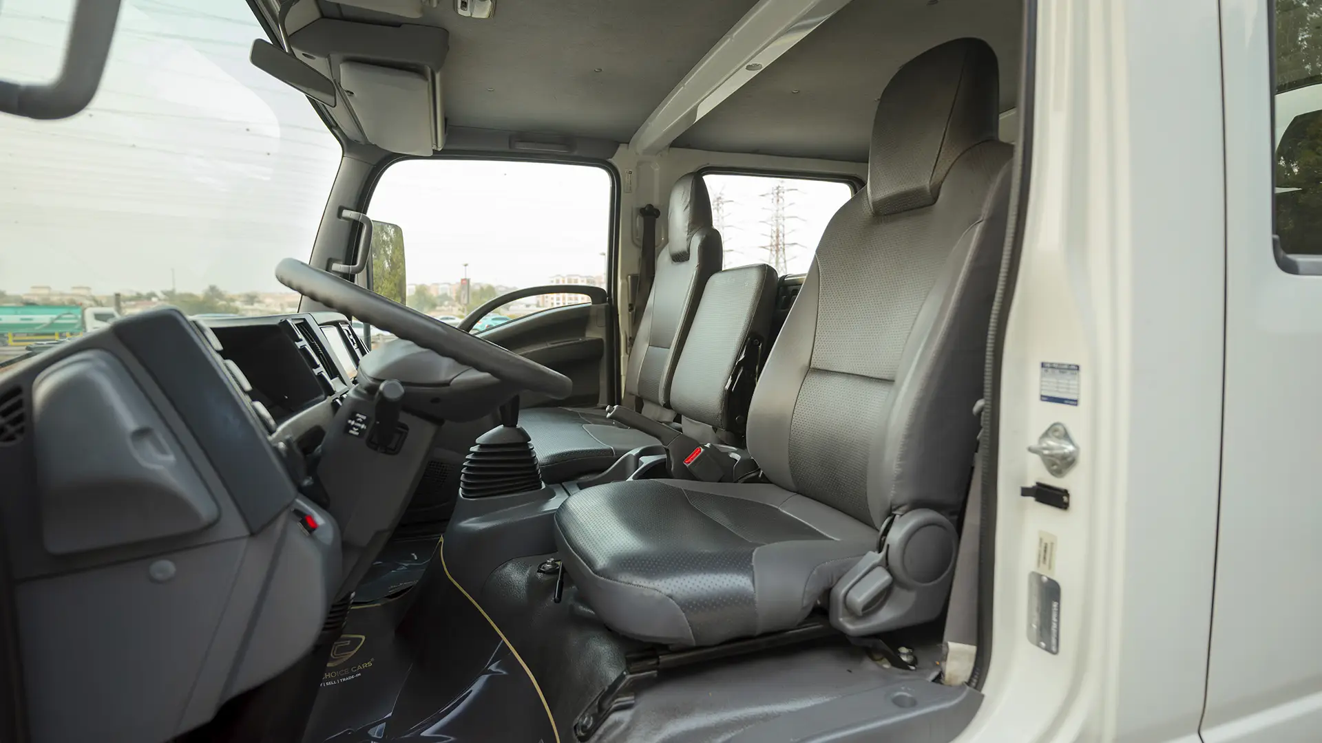 Used 2022 Isuzu N-Series NPR in White – Front Driver Side Cabin View