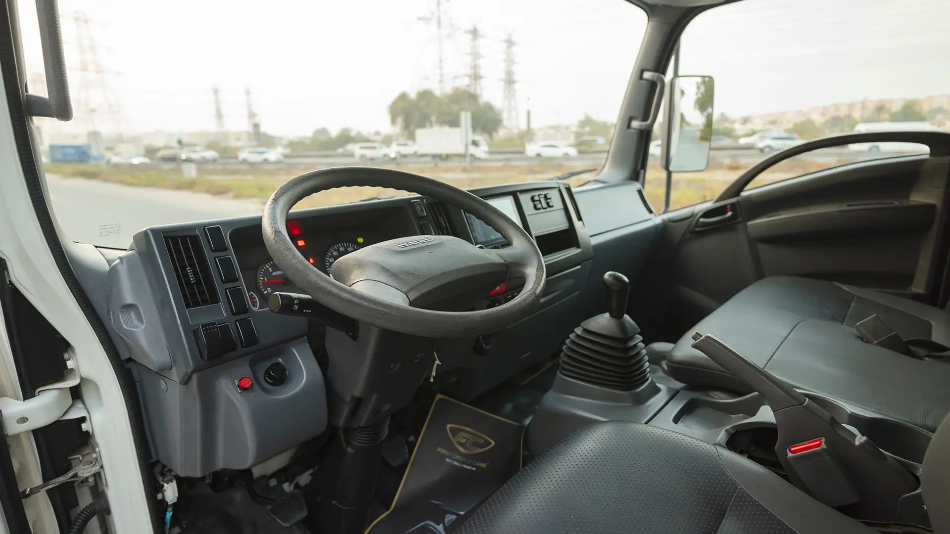 Used 2022 Isuzu N-Series NPR in White – Driver Side Dashboard & Steering View
