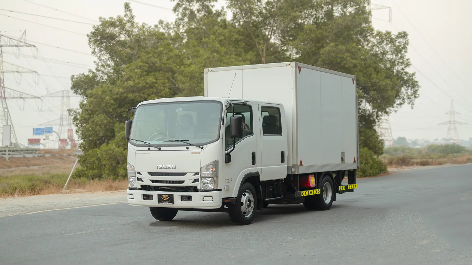 Used 2022 Isuzu NPR Double Cabin Cargo Box in White – Left Front Diagonal (45°) View