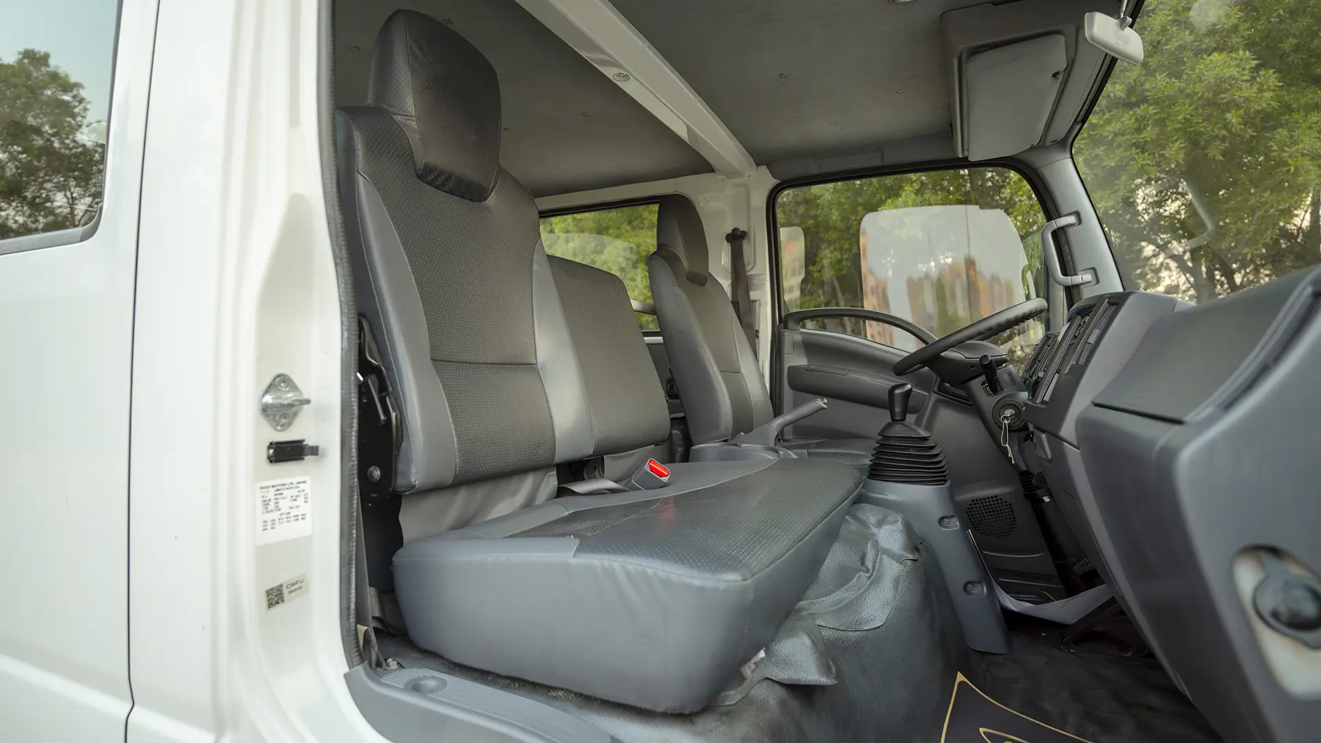 Used 2022 Isuzu NPR Double Cabin Cargo Box in White – Front Passenger Side Cabin View