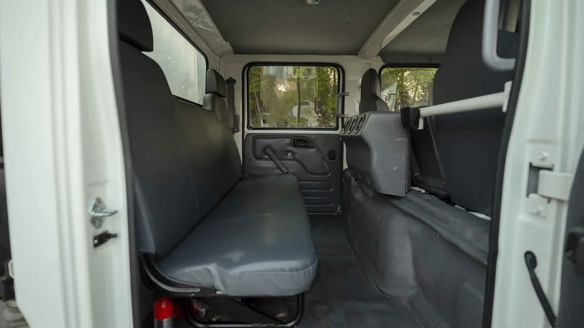 Used 2022 Isuzu NPR Double Cabin Cargo Box in White – Rear Passenger Side Cabin View