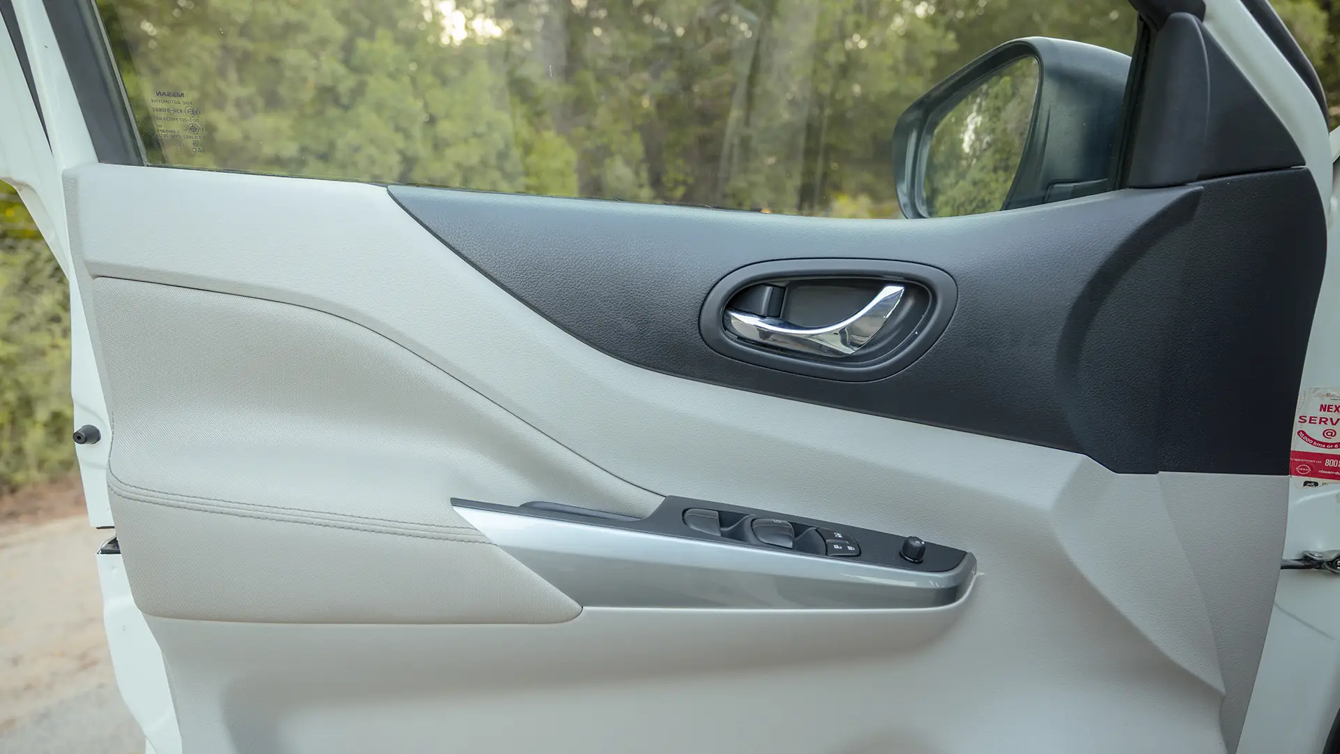 Used 2023 Nissan Xterra SE in White – Driver Door Panel Full View