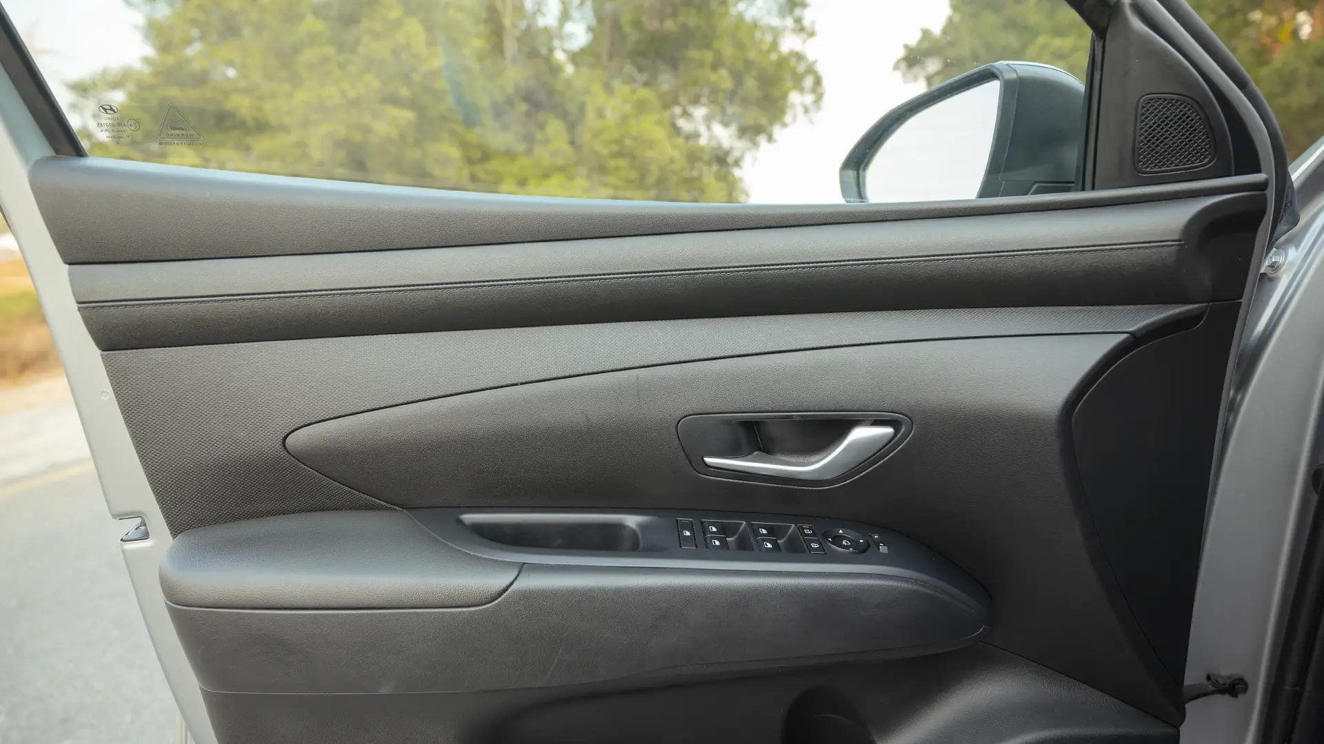 Used 2025 Hyundai Tucson Smart in Silver – Driver Door Panel Full View